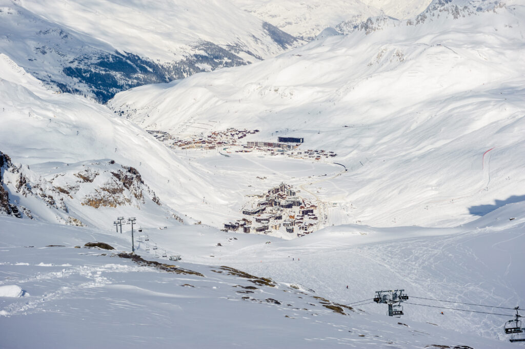Alpine winter mountain landscape. French Alps covered with snow in sunny day. Val-d'Isere, France